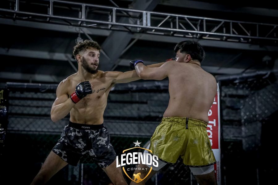 Coach Elijah Halloun throwing a jab during a fight